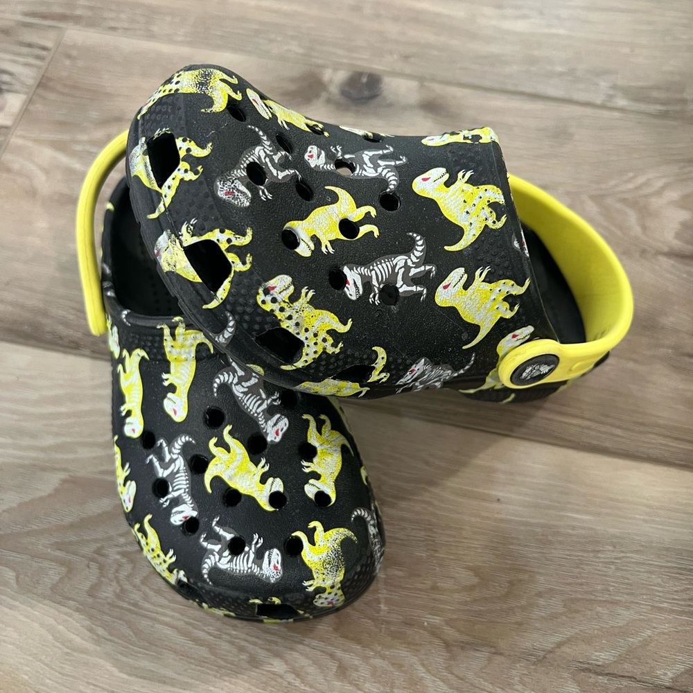 Crocs black/neon dinosaurs size 10